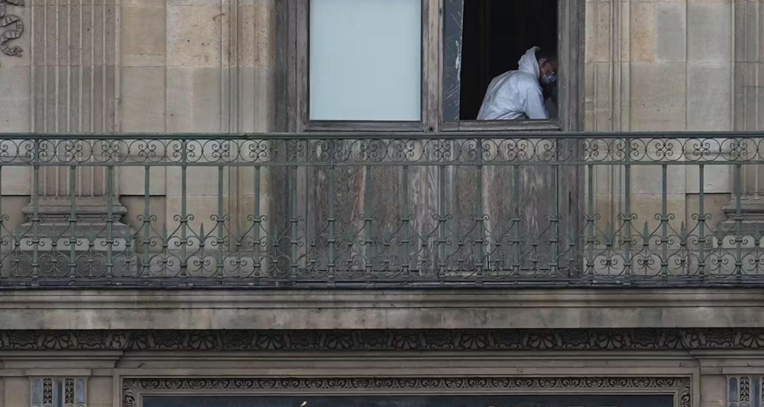 A police officer works inside the Louvre museum on Sunday. 