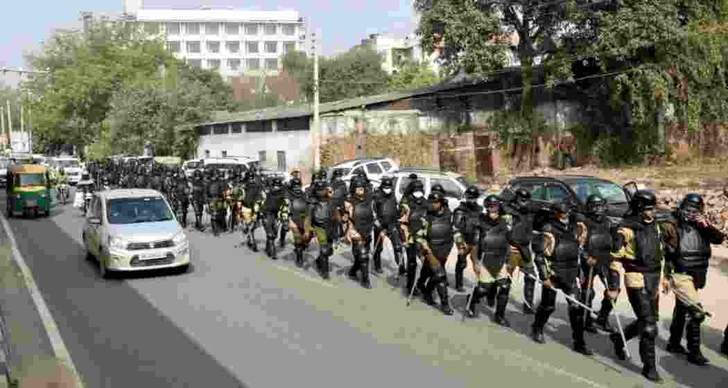 Haryana Police personnel conduct a march near Rajiv Chowk as part of preparations for the farmers' tractor rally in Gurugram. File Photo.