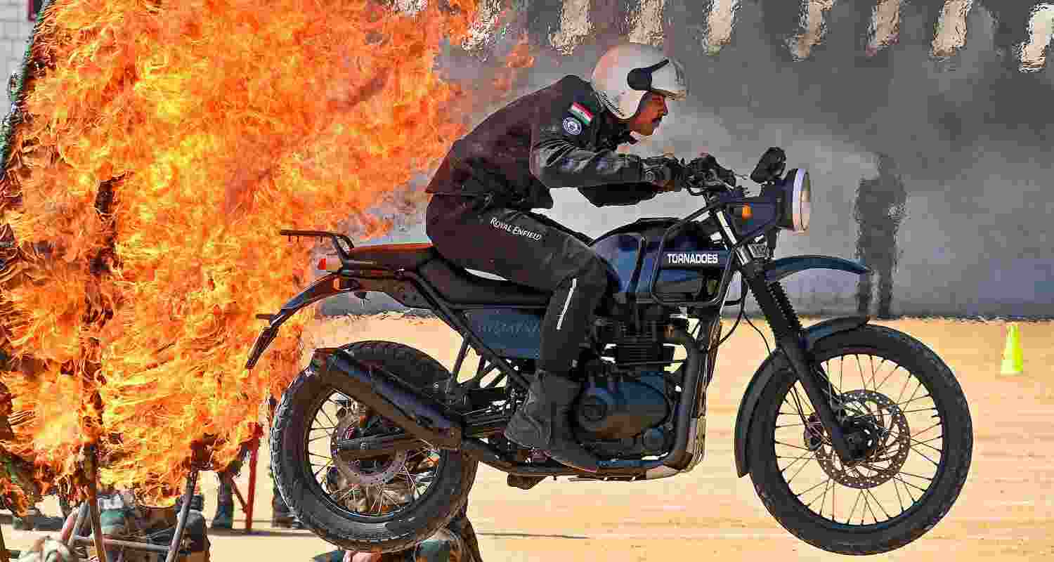Trial by fire: A tornado team member shocks the audience as he rides a motorcycle through a ring of fire, and performs a stunt during the 75th Republic Day celebrations at Field Marshal Manekshaw Parade Ground, in Bengaluru. Motorcycle stunts by trained professionals have been a much-awaited part of Republic Day celebrations.