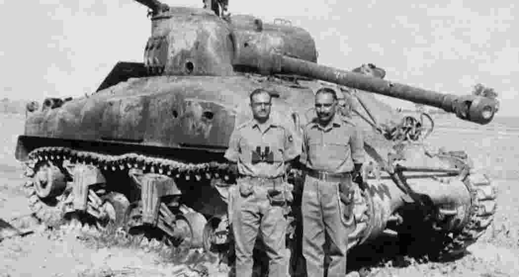 Indian soldiers with a destroyed Pakistani M4A1 Sherman tank.