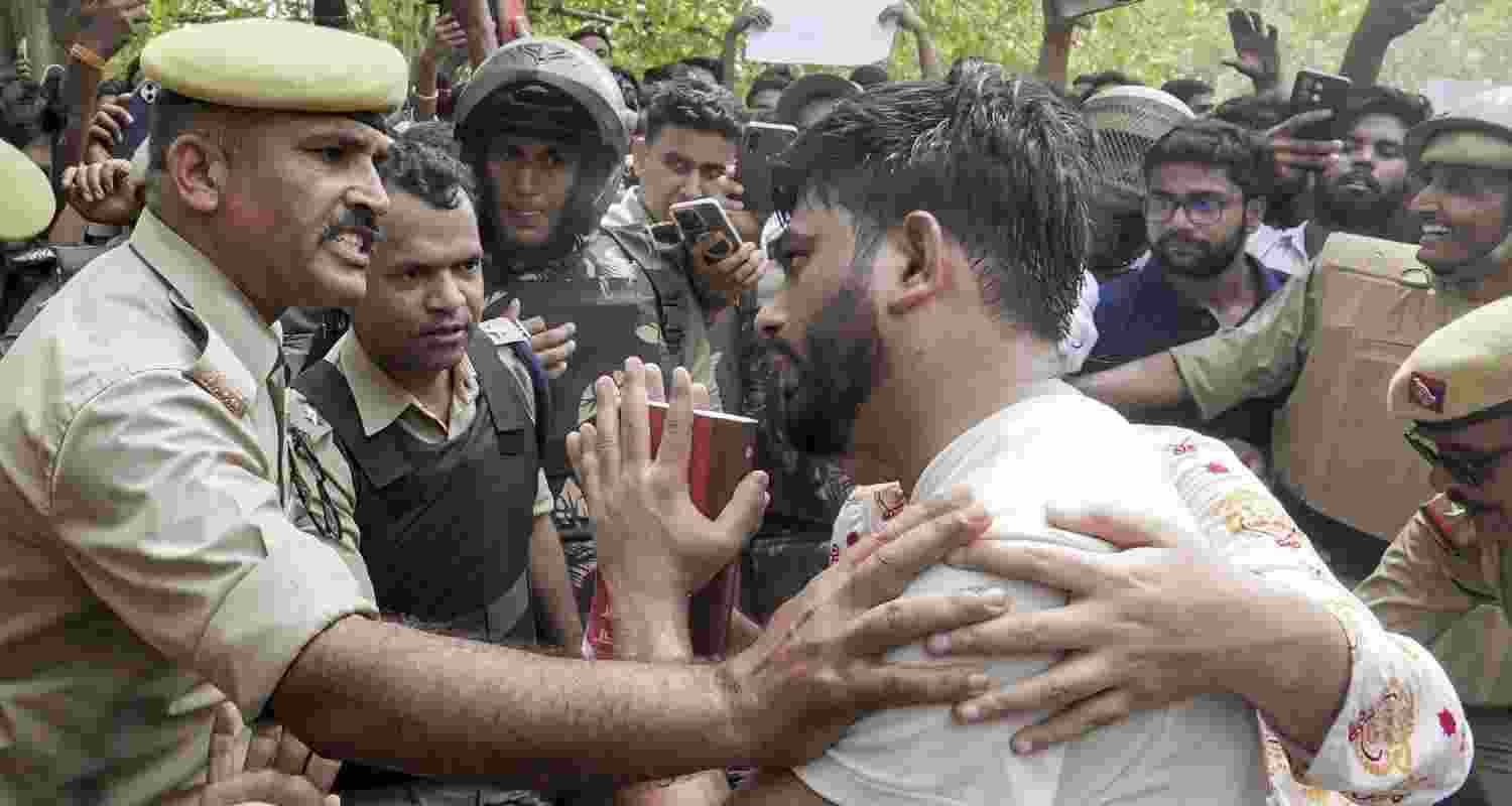 Cockroach Janta Party staged a protest in Lucknow over alleged exam irregularities, demanding Education Minister Dharmendra Pradhan's resignation.