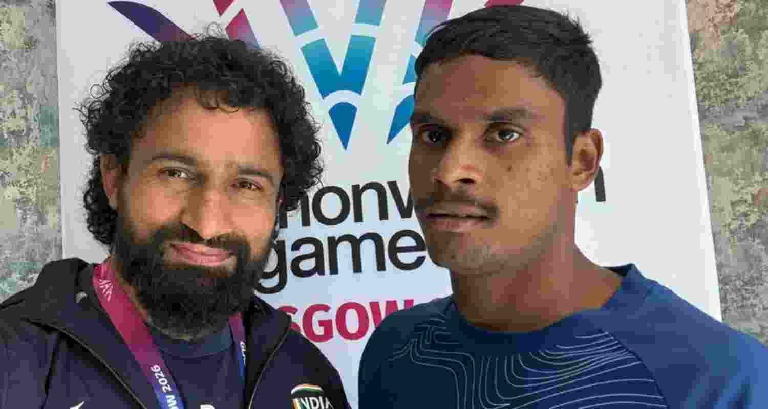 Glasgow Commonwealth Games gold medallist Dilip Mahadu Gavit (right) with his coach Vaijanath Kale, who said the gold medal symbolised much more than sporting success for Dilip.