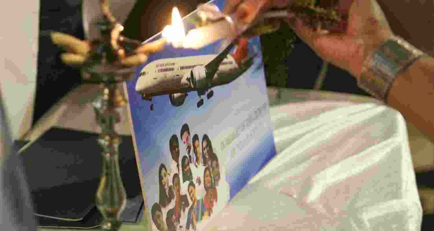 Family members of crew members, who were killed in the Air India Flight 171 crash, pay tribute during a memorial service on the first anniversary of the tragedy, in Mumbai, Maharashtra, Friday, June 12, 2026.