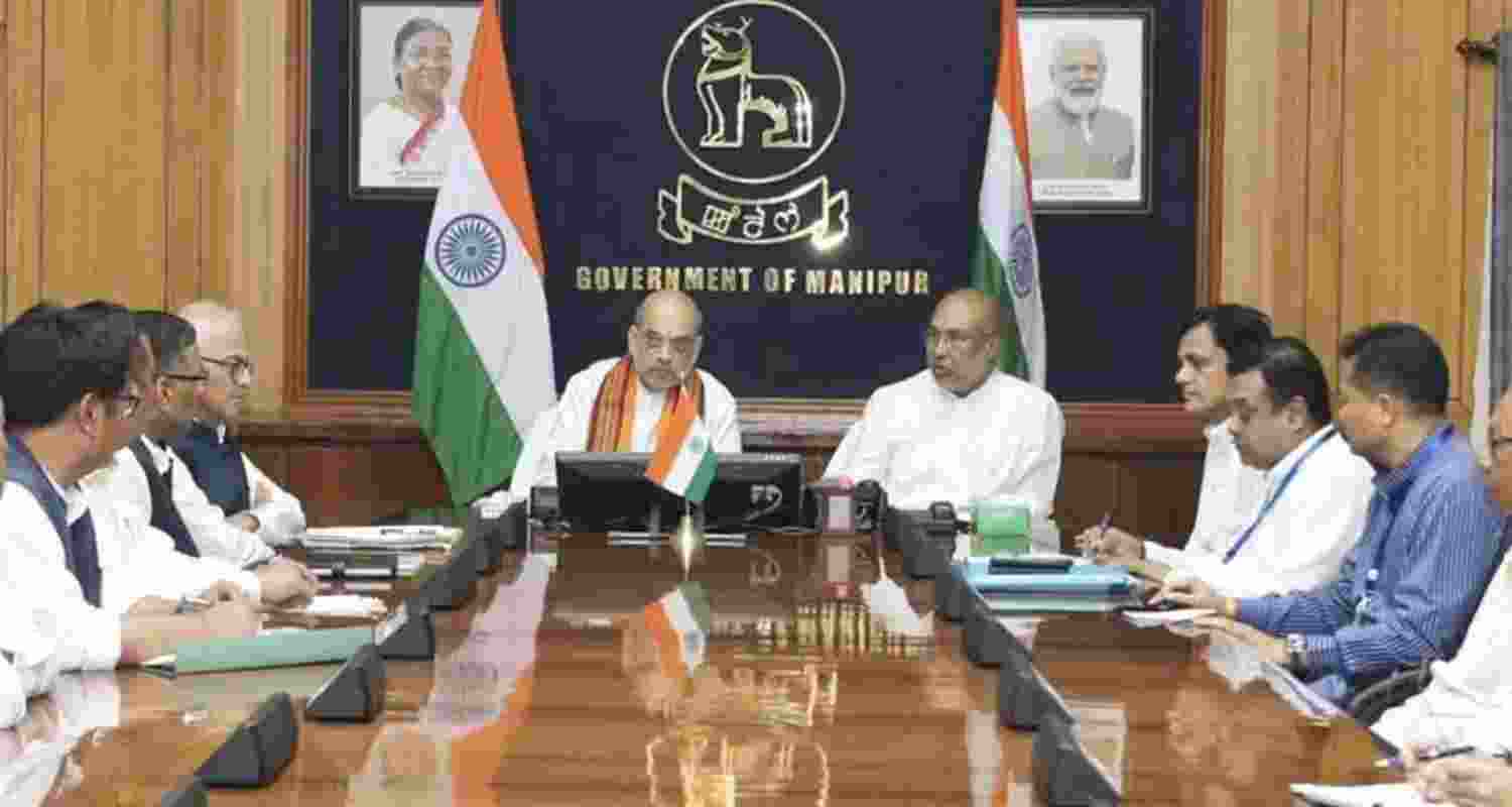 Amit Shah with Manipur Chief Minister N Biren Singh's council of ministers. Amit Shah with Manipur Chief Minister N Biren Singh's council of ministers.