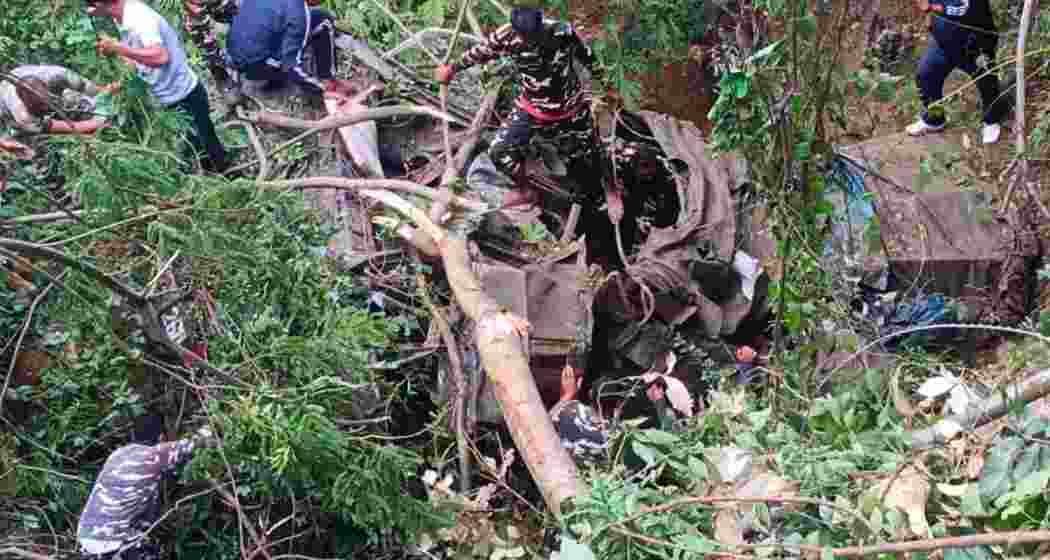 Rescue personnel at the site after an Army truck plunged into a gorge along NH-13 in Arunachal Pradesh's West Kameng district, killing one soldier and injuring two others.
