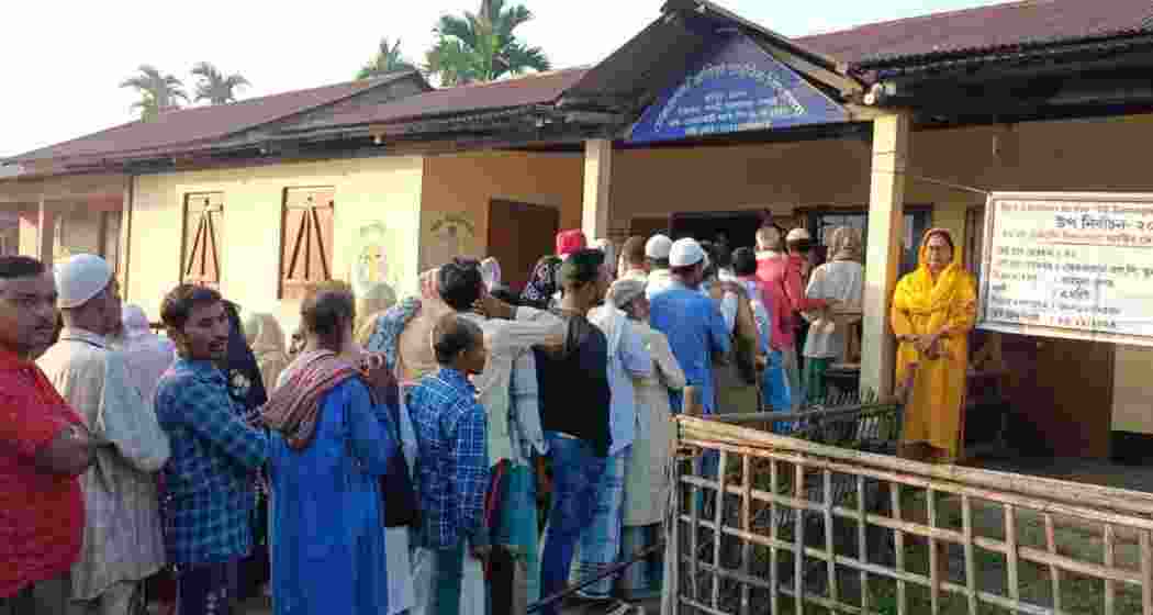 Voters gather to cast their ballots at an Assam assembly by-election centre, where over nine lakh electors across five constituencies are casting their ballots on Wednesday.