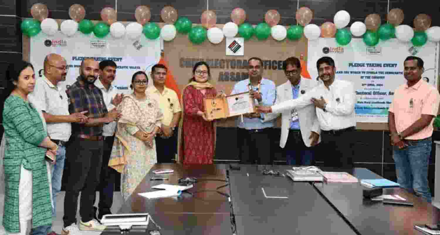 The India Book of Records adjudicator Narvijay Yadav presente the certificate to the Assam Chief Electoral Officer Anurag Goel.