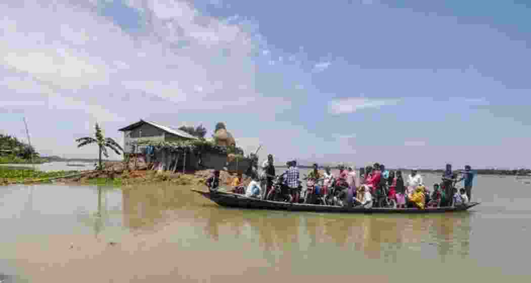 Villagers wade across a flood-affected area due to monsoon rains at Balimukh village in Assam's Morigaon back in 2018. File photo. Villagers wade across a flood-affected area due to monsoon rains at Balimukh village in Assam's Morigaon back in 2018. File photo.
