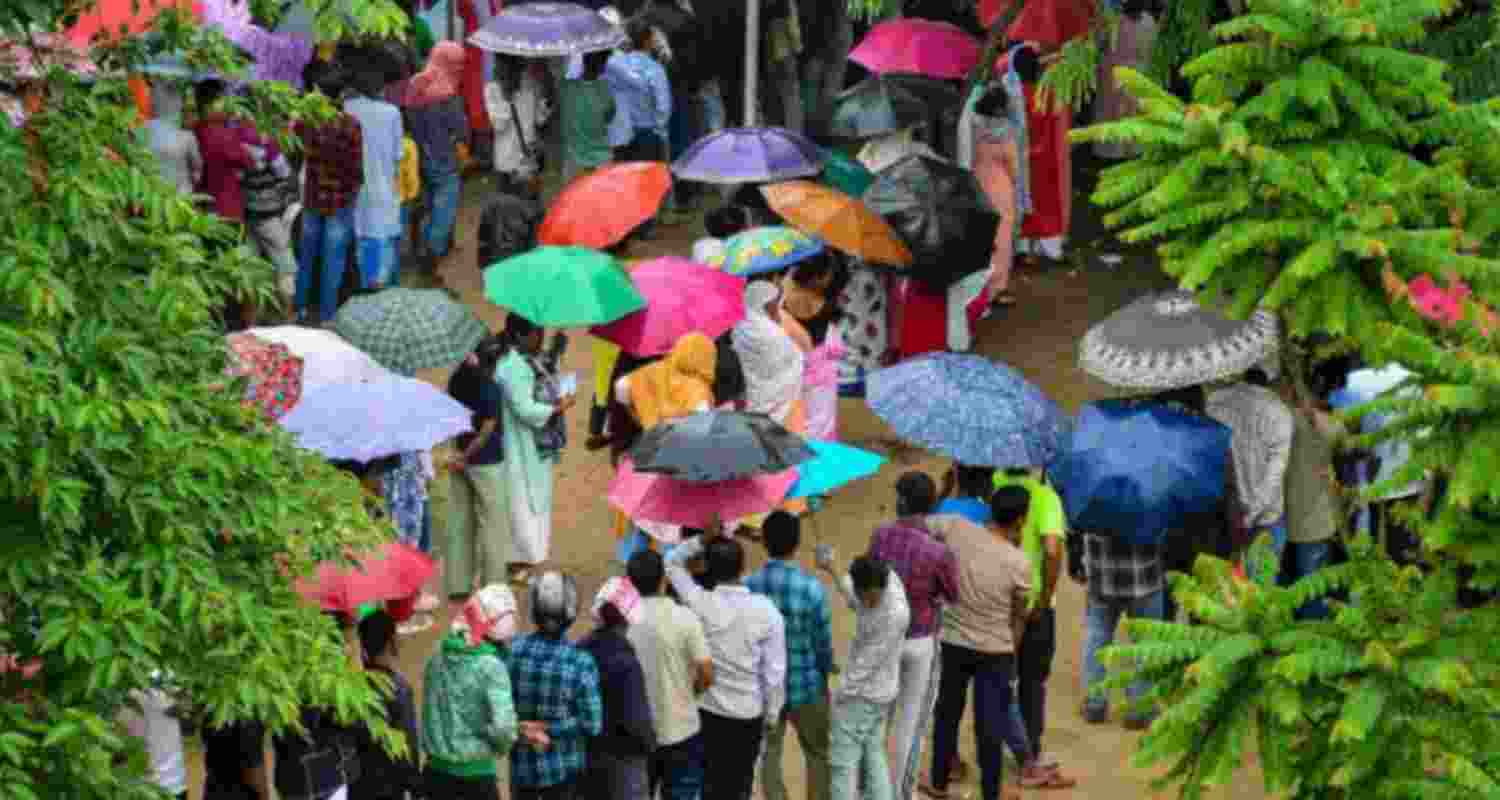 Assam votes amid rain. Assam votes amid rain.