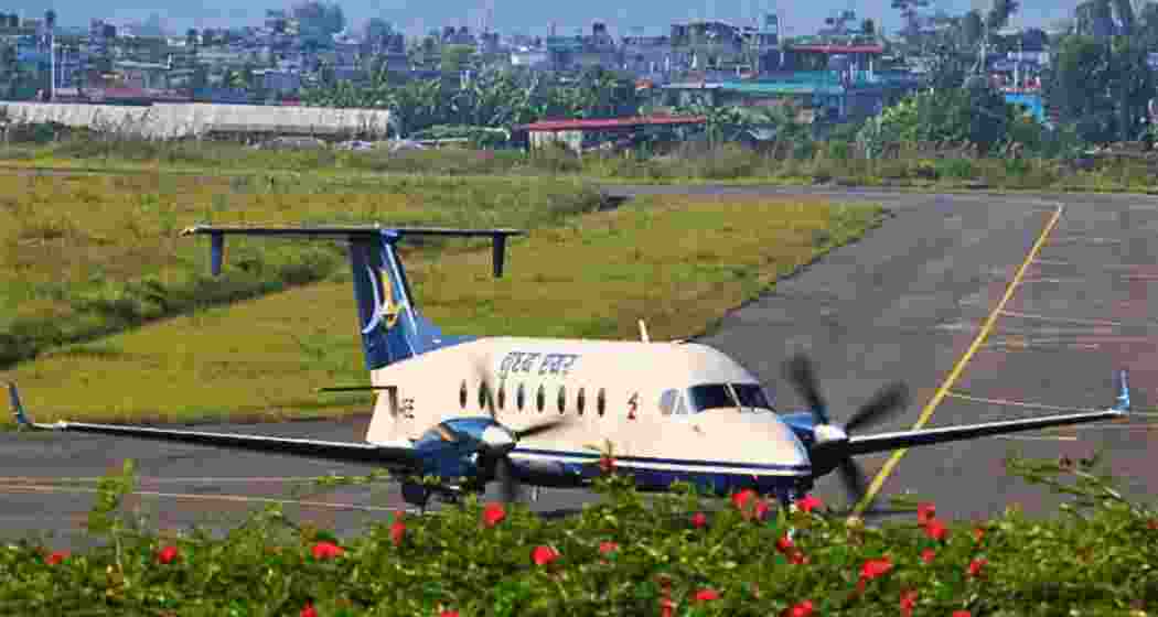 An aircraft moves along the runway at Bagdogra International Airport