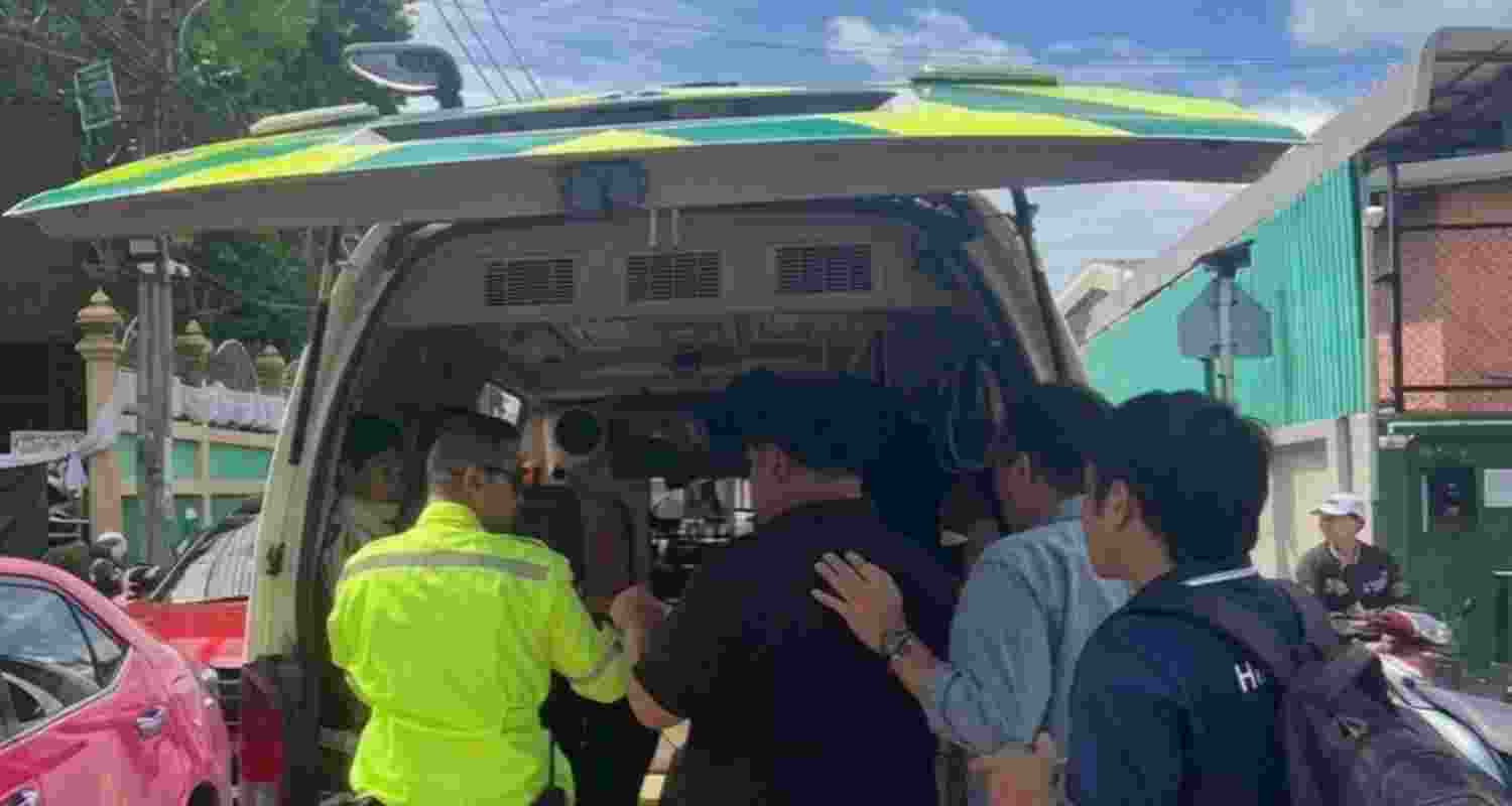 Rescue officials taking the injured to hospital after the school shooting in Bang Kruai district on the outskirts of Bangkok on Friday.