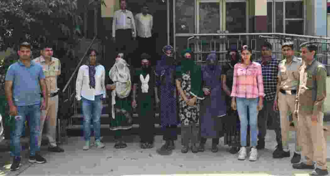 Delhi Police arrested six Bangladeshi migrants (in the middle) disguised as transgender women in Jahangirpuri. They had altered their appearance and used banned apps to evade detection. They have been handed over for deportation.