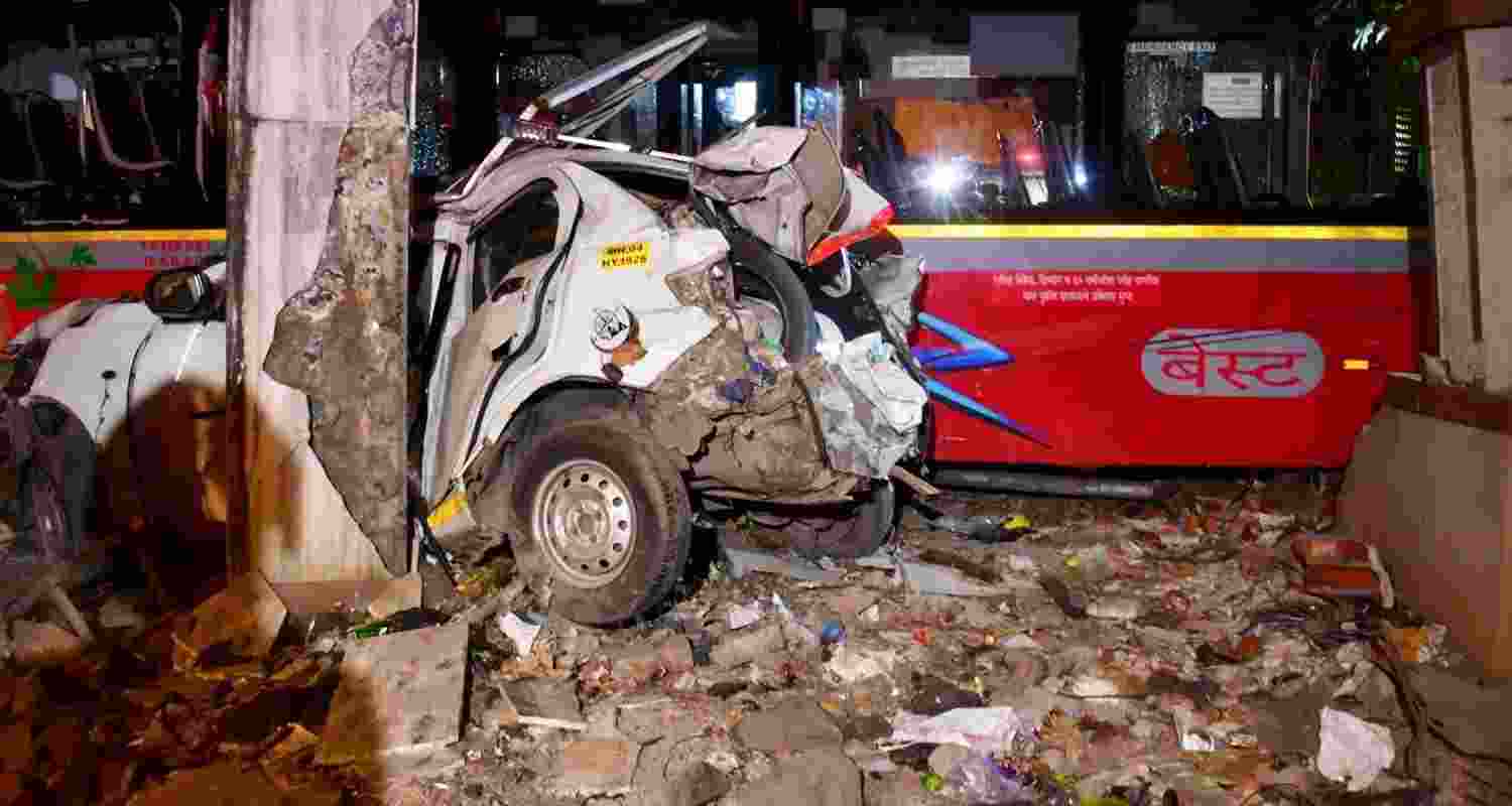 Wreckage of a car after a speeding Brihanmumbai Electricity Supply and Transport Undertaking (BEST) bus collided with several vehicles on a road at Kurla, in Mumbai, Monday.