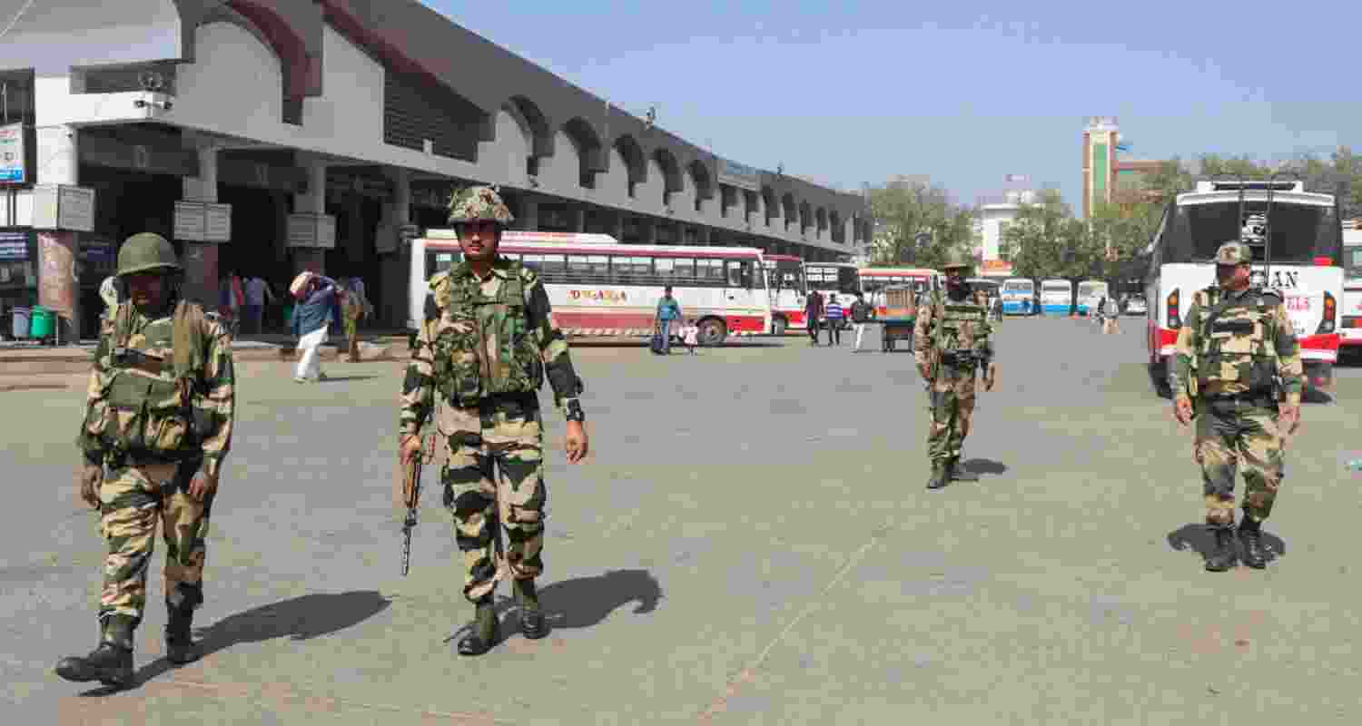 Security personnel keep a vigil at the Rohtak Bus Depot during 'Bharat Bandh', in Rohtak, Friday, Feb. 16, 2024. The Samyukta Kisan Morcha (SKM) has called for the 'Bharat Bandh' to press the BJP-led central government to accept farmers' demands, including a legal guarantee of minimum support price (MSP) for crops. Security personnel keep a vigil at the Rohtak Bus Depot during 'Bharat Bandh', in Rohtak, Friday, Feb. 16, 2024. The Samyukta Kisan Morcha (SKM) has called for the 'Bharat Bandh' to press the BJP-led central government to accept farmers' demands, including a legal guarantee of minimum support price (MSP) for crops.