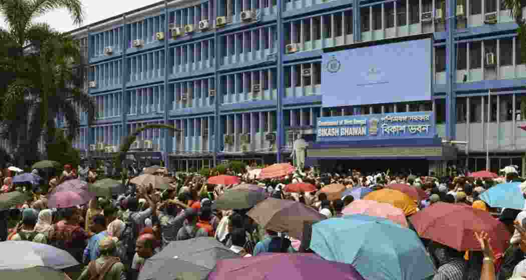 School teachers, who have been rendered jobless by a Supreme Court order, stage a protest demanding restoration of their jobs, in front of the office of the state education minister in Kolkata.