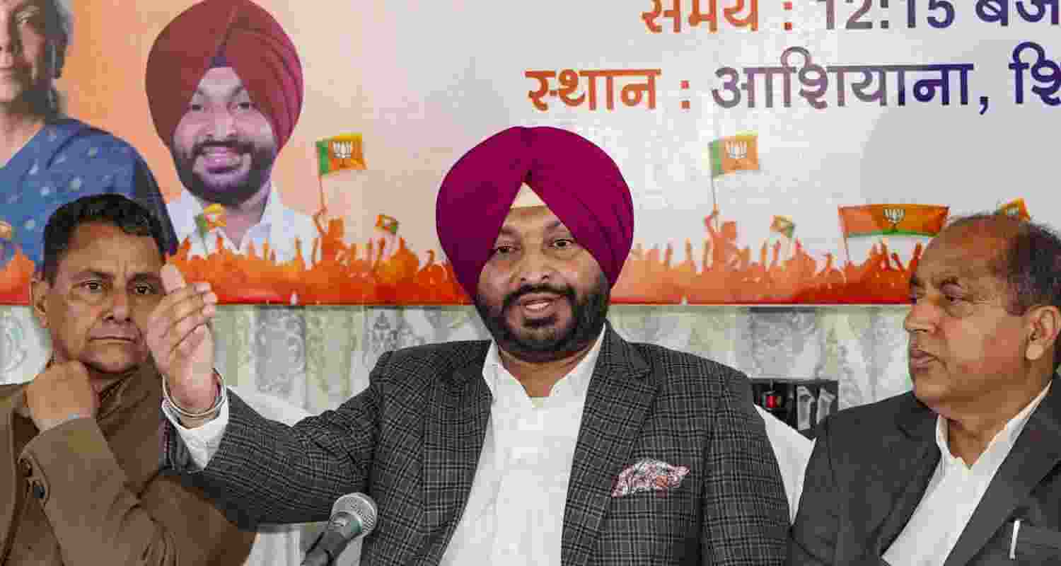 Union Minister Ravneet Singh Bittu with former Chief Minister Jai Ram Thakur addresses a press conference, in Shimla, Tuesday. 