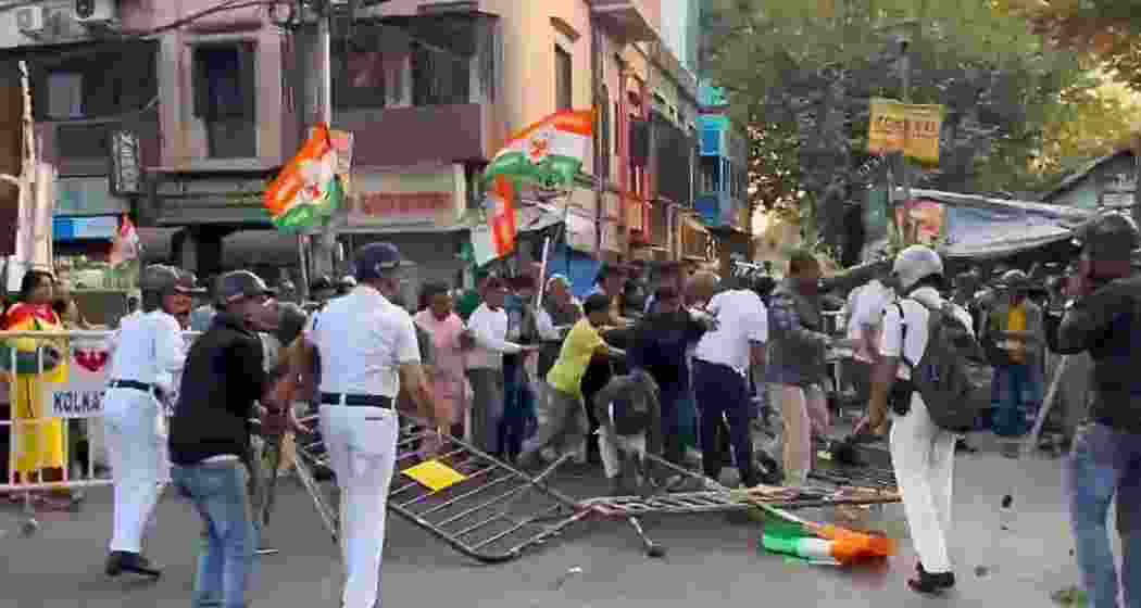 Scenes from Kolkata Entally where Congress workers clashed with BJP Yuva Morcha activists during a protest. The confrontation occurred amid allegations of assault on BJP MPs in Parliament, with Mamata Banerjee's police accused of inaction.