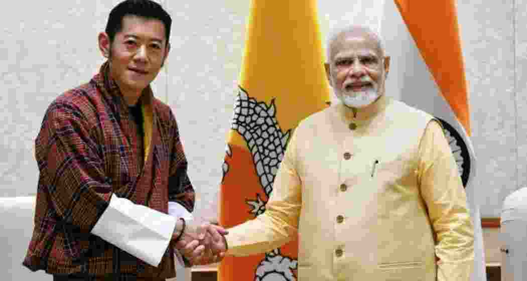 Bhutan King Jigme Khesar Namgyel Wangchuck shakes hands with Prime Minister Narendra Modi Bhutan King Jigme Khesar Namgyel Wangchuck shakes hands with Prime Minister Narendra Modi
