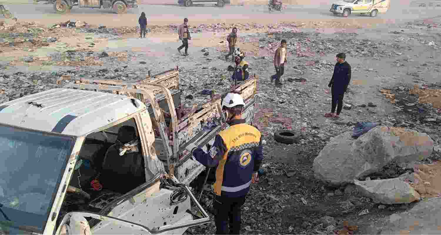 Locals at the site of the explosion near Aleppo, Syria.