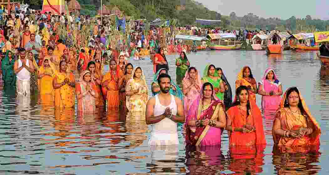 Devotees gathered on the riverside to offer 'arghya' to the rising sun, marking the conclusion of Chhath Puja.