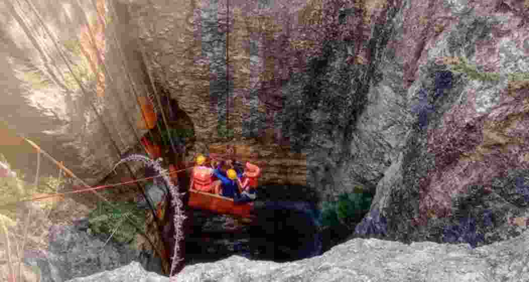 Navy divers and rescue personnel try to enter the flooded Assam coal mine, where nine workers are trapped. Challenging terrain and water levels continue to hamper the ongoing rescue operations.