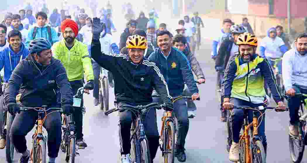 Sports Minister Mansukh Mandaviya (C) cycles alongside Leander Paes (L) and Pullela Gopichand (R) during the 56th edition of the Fit India initiative, ‘Sundays on Cycle’, in New Delhi on Sunday.