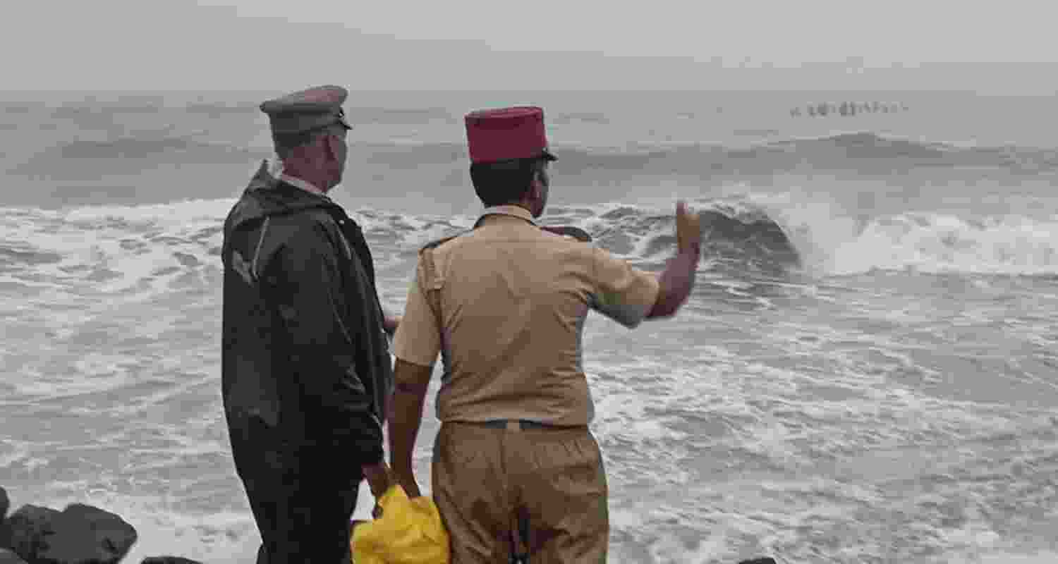 Security personnel conduct inspection as sea waves crash against the shore amidst a warning issued by the India Meteorological Department (IMD) that a deep depression over the southwest Bay of Bengal is likely to intensify into Cyclone 'Fengal' and move towards Tamil Nadu, in Puducherry, Wednesday, Nov. 27, 2024. Security personnel conduct inspection as sea waves crash against the shore amidst a warning issued by the India Meteorological Department (IMD) that a deep depression over the southwest Bay of Bengal is likely to intensify into Cyclone 'Fengal' and move towards Tamil Nadu, in Puducherry, Wednesday, Nov. 27, 2024.