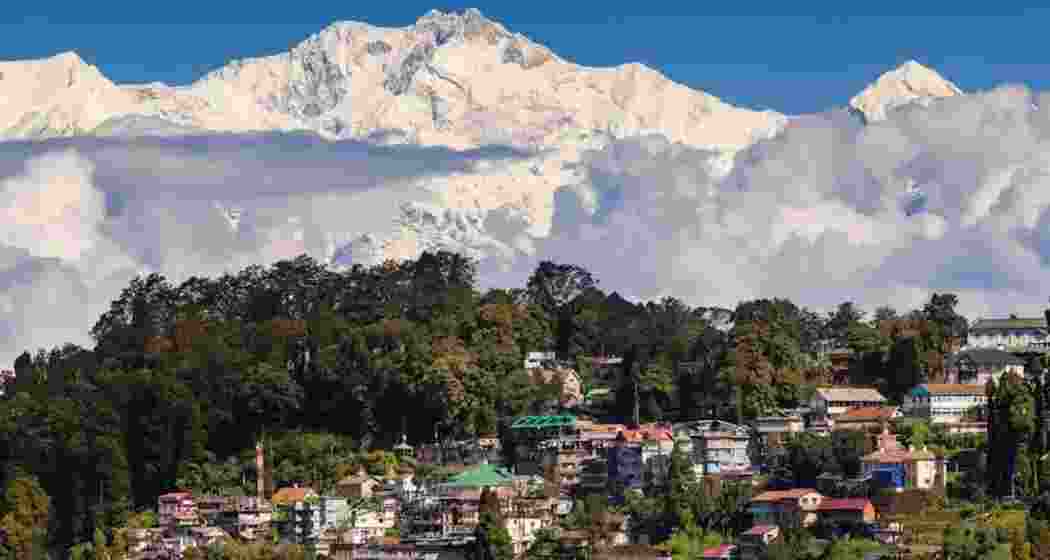 A view of the mighty Kanchenjunga rising behind Darjeeling town on Christmas, as clear winter skies and plunging temperatures brought a festive chill to the hills.