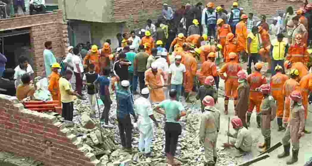 Rescue teams from the NDRF and Delhi Fire Services at the site of a building collapse in Mustafabad, Delhi, where four people died and several remain trapped under the rubble.