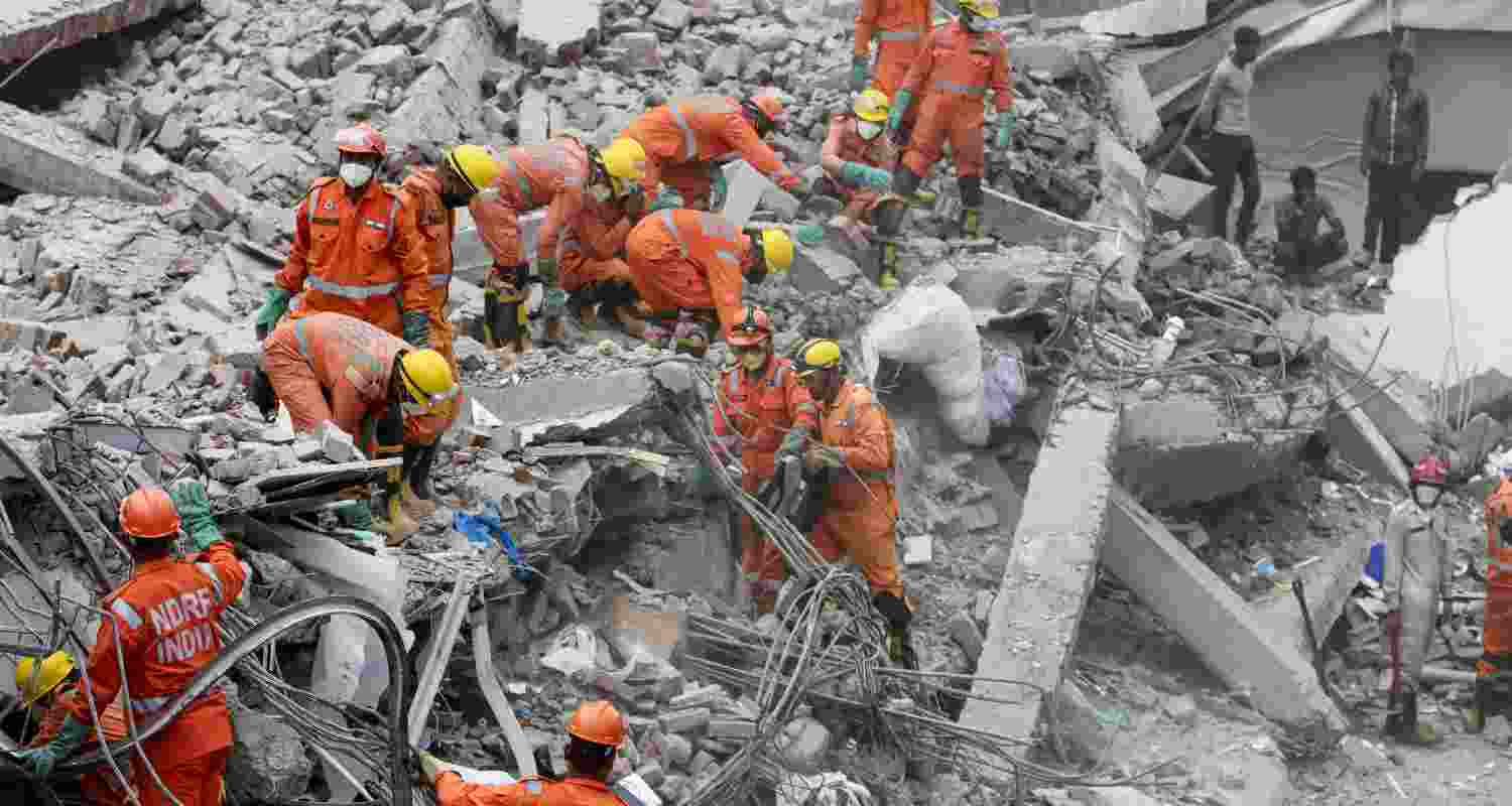 NDRF and police conduct a rescue operation after a three-storey commercial building collapsed on Saturday evening near the Saket Metro station, in New Delhi, Sunday, May 31, 2026. 