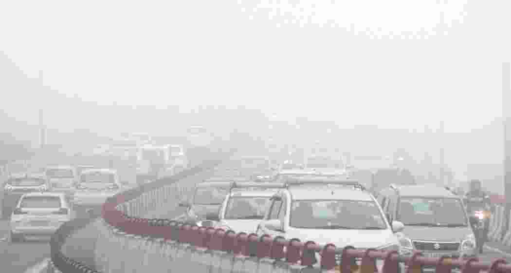 Vehicles move on a road amid morning fog, in New Delhi on Friday, Jan. 3, 2025. Vehicles move on a road amid morning fog, in New Delhi on Friday, Jan. 3, 2025.