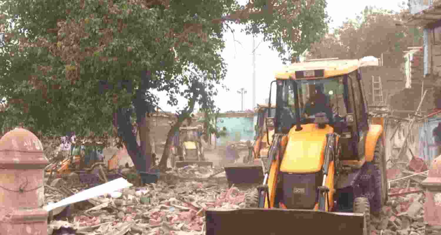 Demolition drive underway at Madrasi Camp in Jangpura.