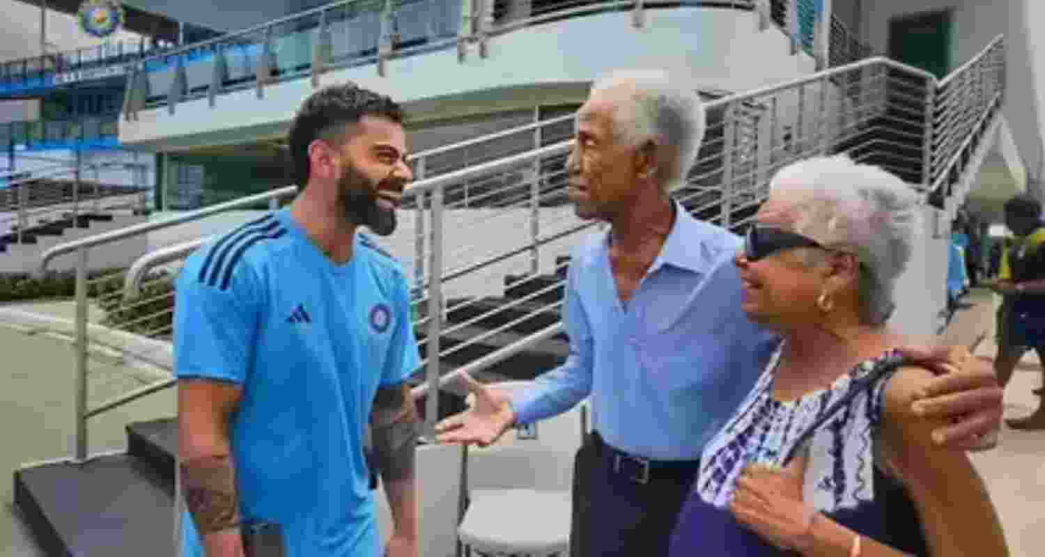 A file photograph of Virat Kohli with Sir Garry Sobers and his wife.