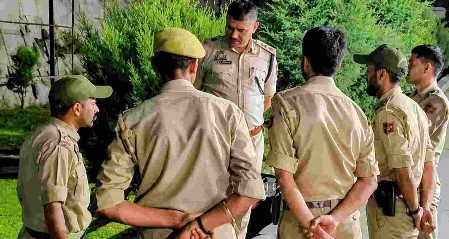 A man was killed and three J&K SOG personnel injured in an alleged weapon-snatching bid in Doda. Police detained a religious preacher and launched a probe.