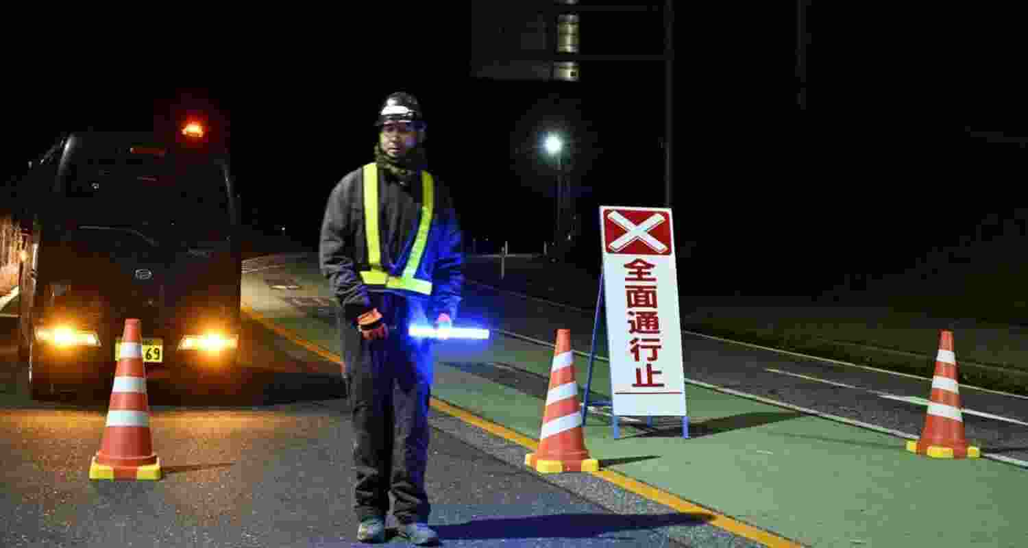 Traffic is restricted on a road following the issuance of a tsunami warning in Iwate Prefecture, Japan.