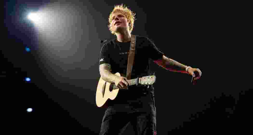 Ed Sheeran captivating the audience during a performance.