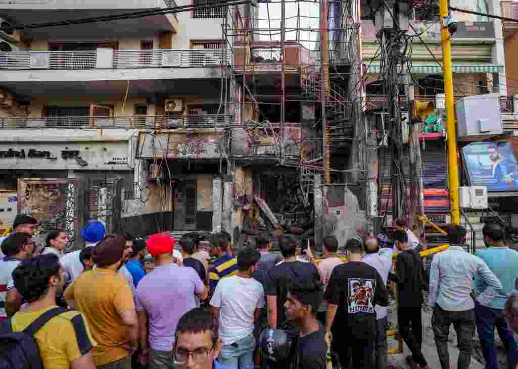 Parents wait to identify children, others seek information on cause of fire.