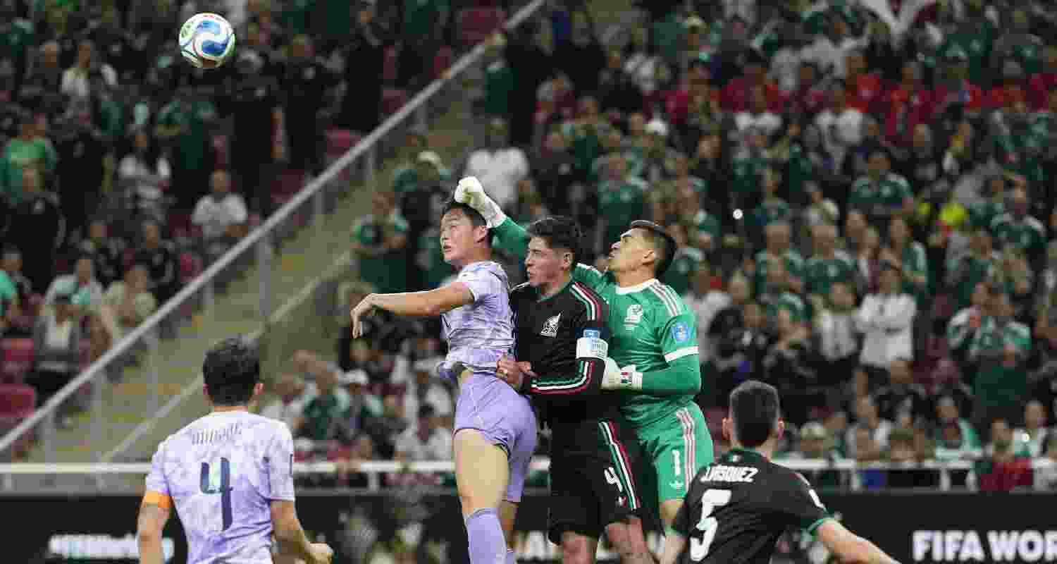 Mexico goalkeeper Raul Rangel (1) and Edson Alvarez (4) make a save against South Korea's Oh Hyeon-gyu during the World Cup Group A soccer match between Mexico and South Korea in Zapopan, near Guadalajara, Mexico, Thursday, June 18, 2026. 