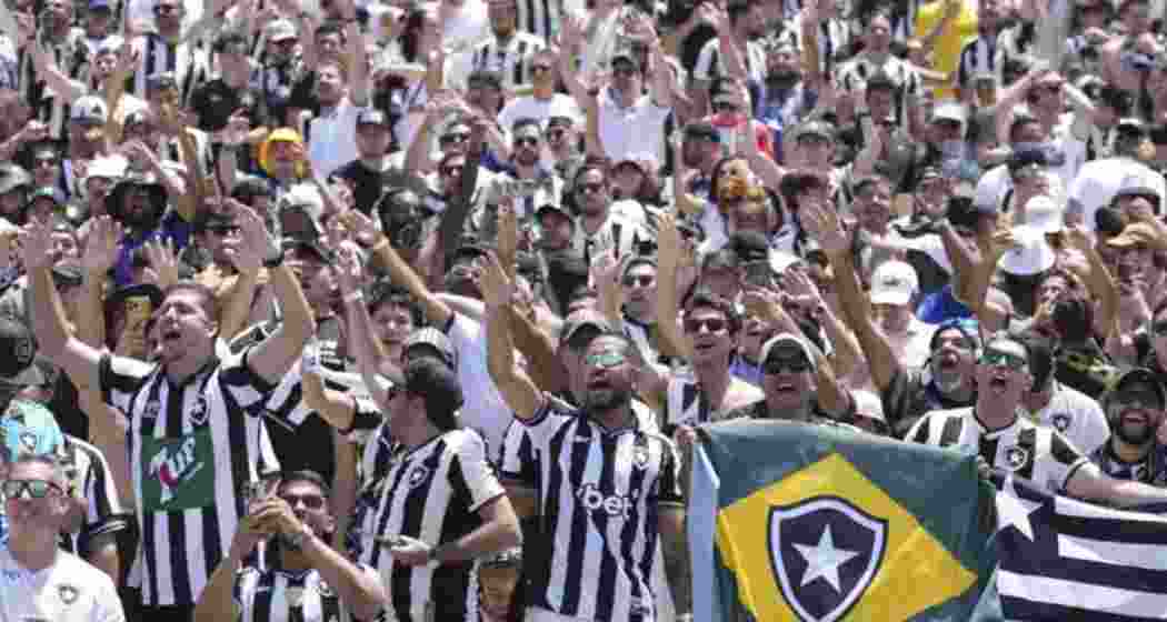 Batafogo fans cheer for their team after the Brazilian team's Club World Cup match against Atletico Madrid.