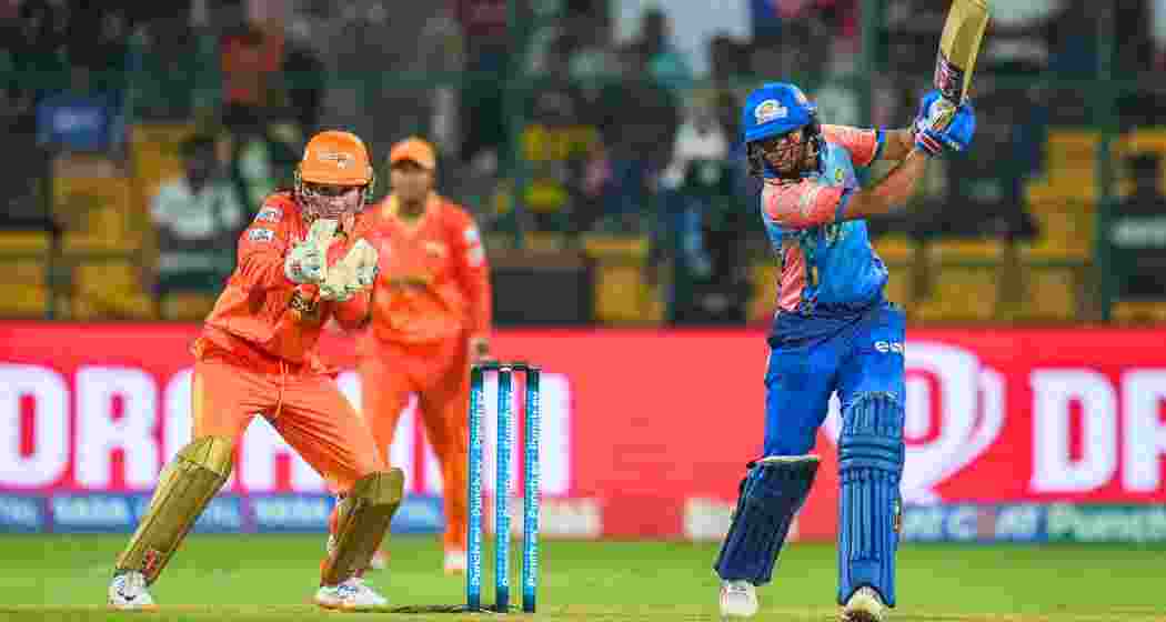 Mumbai Indians batter Harmanpreet Kaur plays a shot during a Women's Premier League match between Mumbai Indians and Gujarat Giants. Mumbai Indians batter Harmanpreet Kaur plays a shot during a Women's Premier League match between Mumbai Indians and Gujarat Giants.