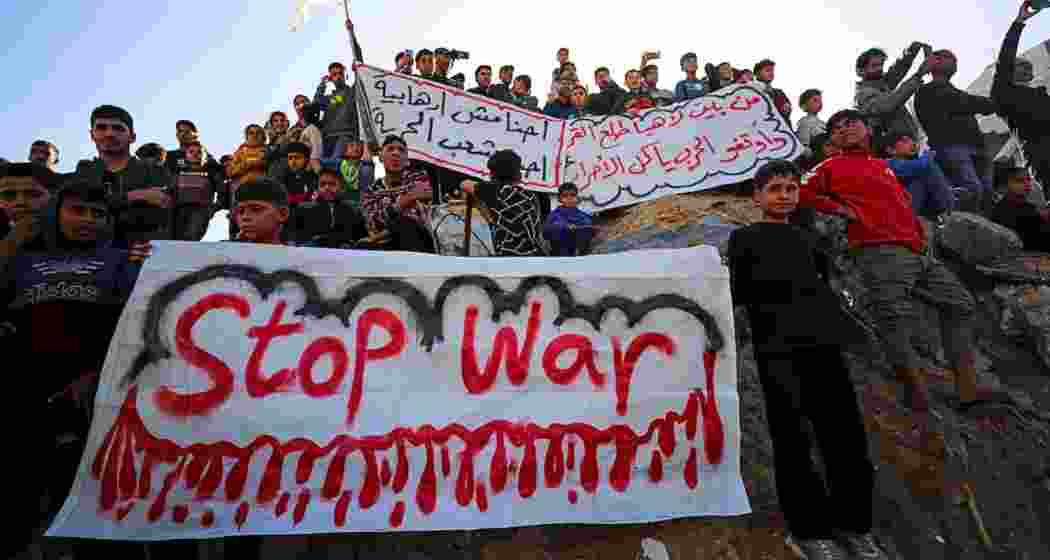 Palestinians protest to demand an end to war, chanting anti-Hamas slogans, in Beit Lahiya in the northern Gaza Strip on March 26, 2025.