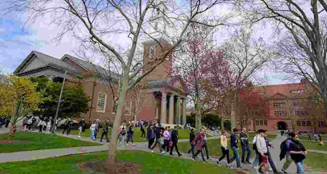 Students walking through Harvard University’s iconic campus in Cambridge, Massachusetts. Students walking through Harvard University’s iconic campus in Cambridge, Massachusetts.
