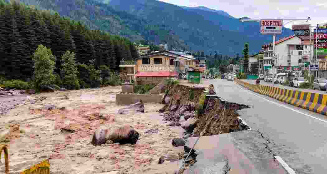 A road near Wabi Cafe on Rangri Road, Manali, washed away as the Beas River swelled dangerously due to heavy monsoon rain, leaving the area severely damaged and inaccessible.
