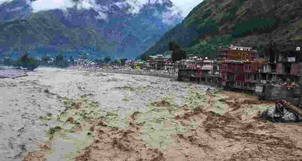 Raging torrents swell the Beas River in Himachal Pradesh's Mandi district following intense cloudbursts, sweeping away homes and roads.