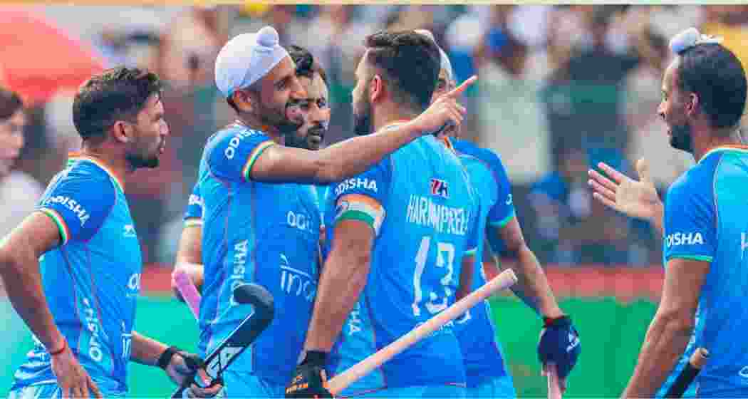 Indian hockey players celebrate after converting a penalty corner against Japan in Rajgir on Sunday.