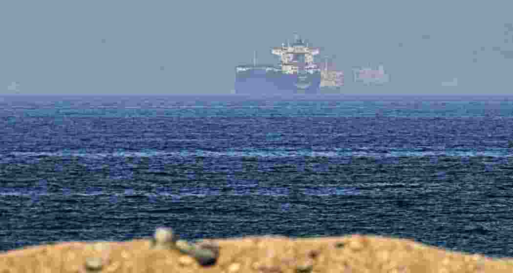 Cargo ships are seen at sea near the Strait of Hormuz, as viewed from a rocky shoreline near Khor Fakkan, United Arab Emirates, Friday, May 1, 2026. (Photo: AP)