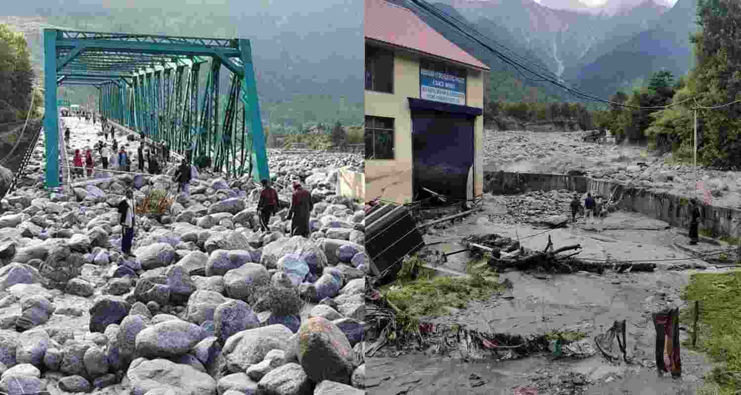People stand near debris after flash floods triggered by cloud burst, near Manali. People stand near debris after flash floods triggered by cloud burst, near Manali.