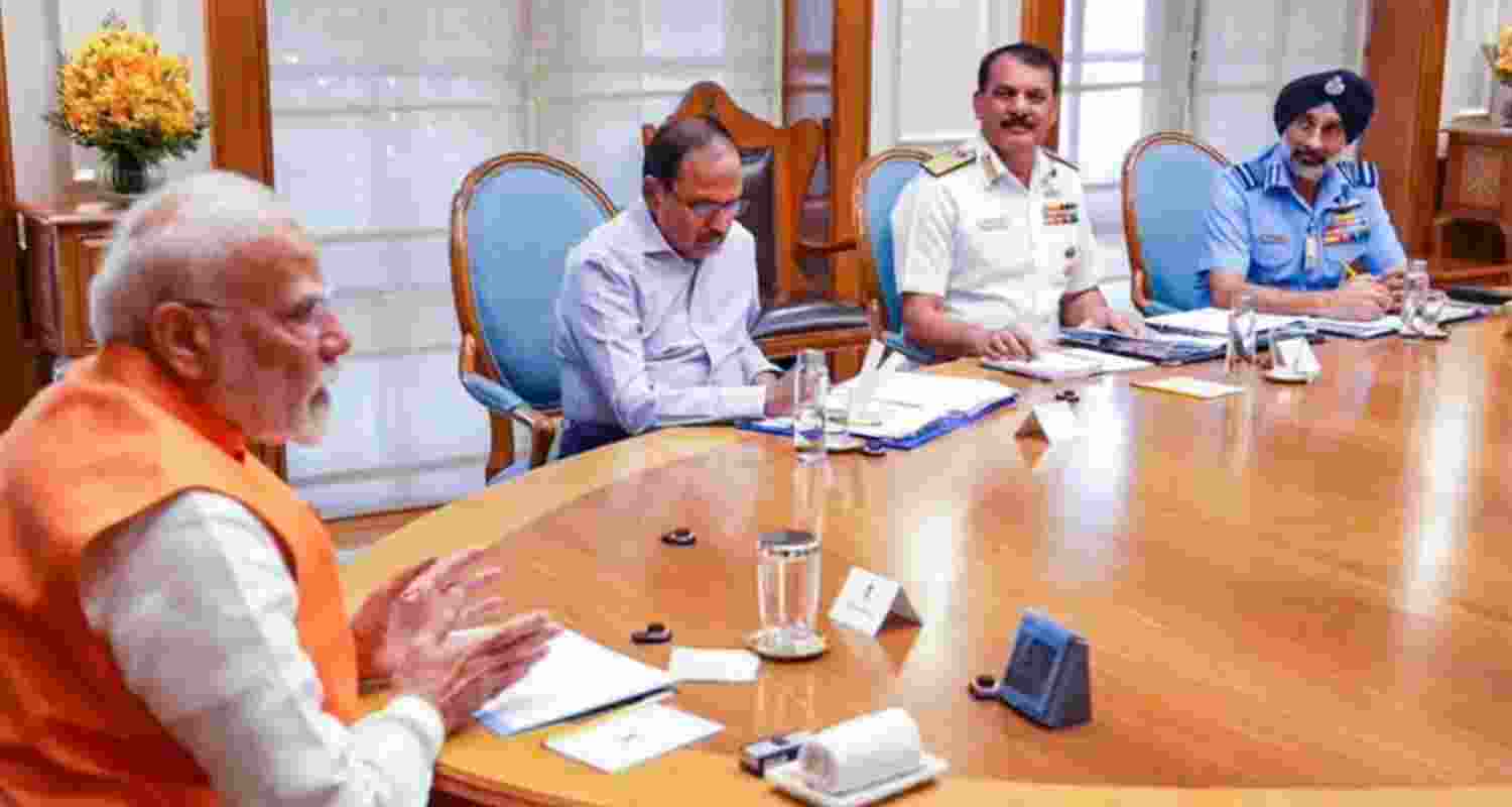 A file photo of Prime Minister Narendra Modi with NSA Ajit Doval, Navy Chief Admiral Dinesh K Tripathi and IAF Chief Air Chief Marshal Amar Preet Singh during a meeting in New Delhi, April 29.