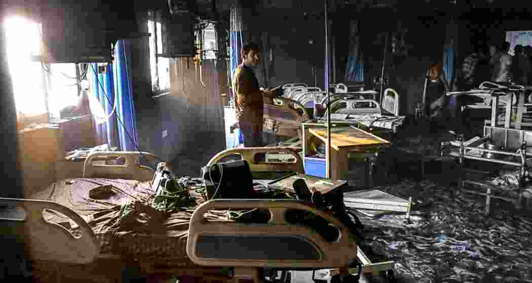  A man looks at the charred remains after a fire broke out in the ICU of a private hospital in Bihar's Muzaffarpur district, Thursday, June 4, 2026. At least three people were killed in the incident. (PTI Photo)