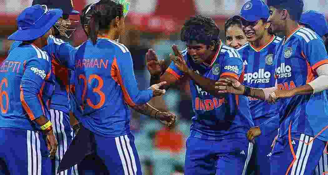 Indian women players celebrate after taking a wicket during an international fixture.